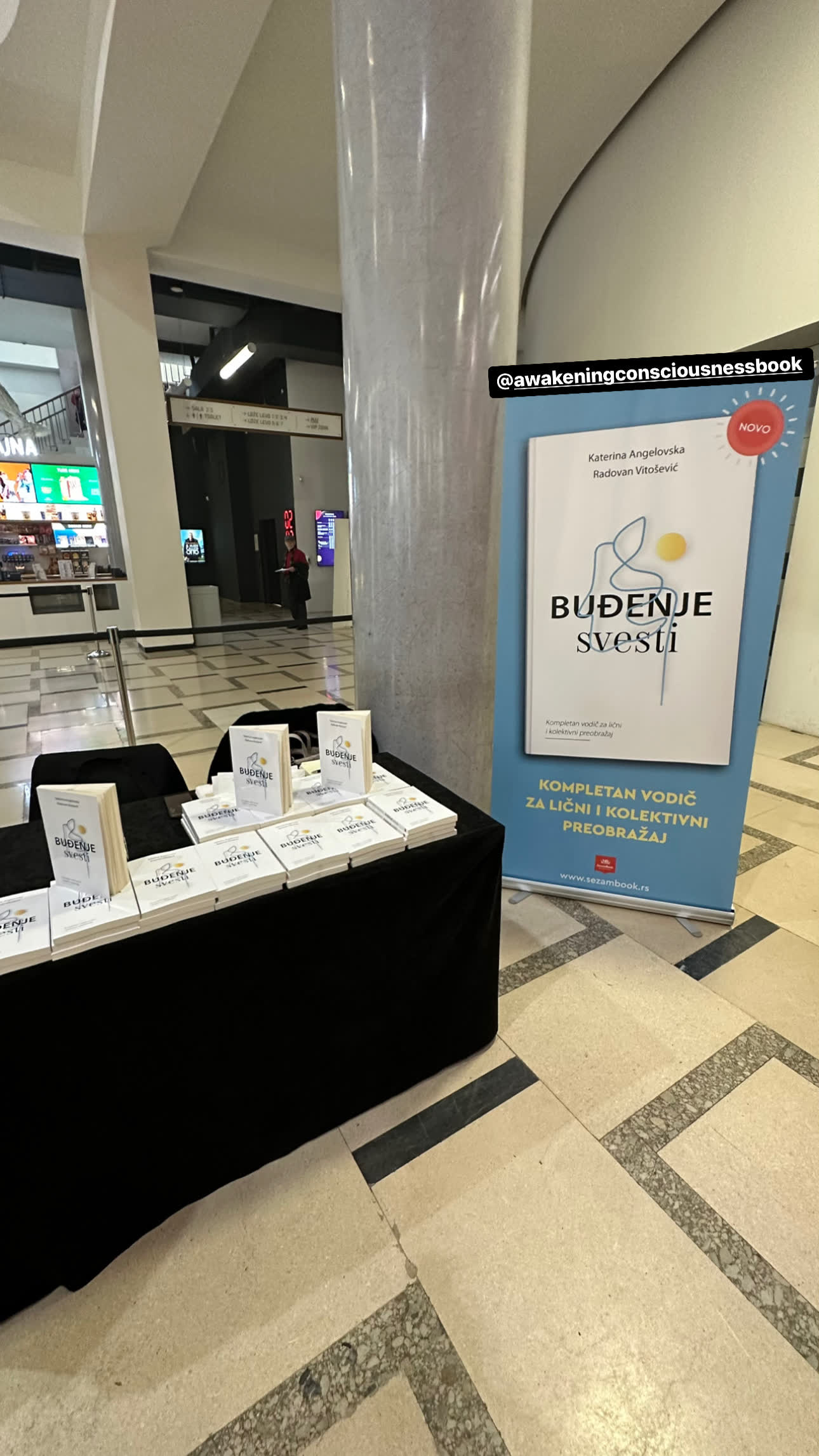 The display table of Buđenje svesti at the Belgrade promotion, 2023, with the title banner