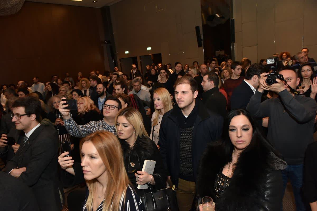 A full room at the Skopje launch of Будење на свеста in 2019, photographers among the audience